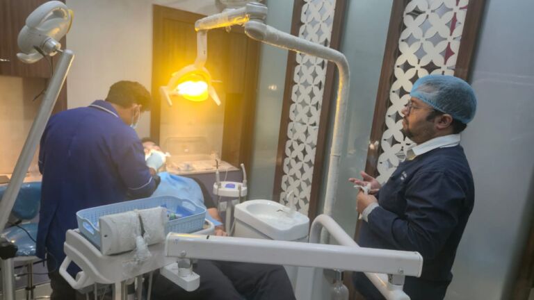 Is teeth cleaning painful for patients? Professional dentist carrying out painless teeth cleaning procedure with advanced dental equipment.